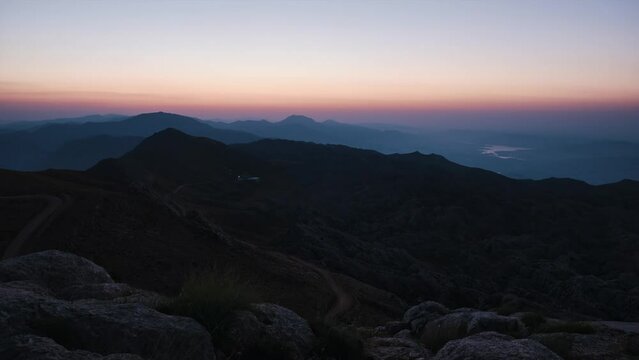 Timelapse of sun rising above mountains. Top of Nemrut Dag mount, Adiyaman province, Turkiye