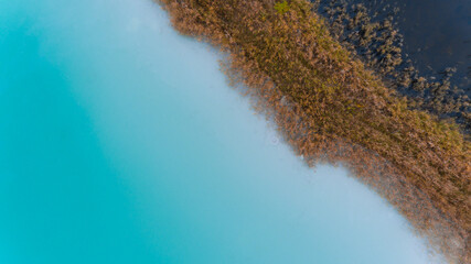 Top view aerial drone photo of seascape with turquoise water lagoon