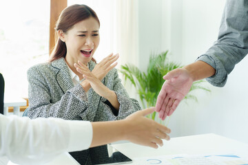 Fototapeta premium Opposition to merger concept, businesswoman expressing dissatisfaction with two firms joining hands for a joint venture