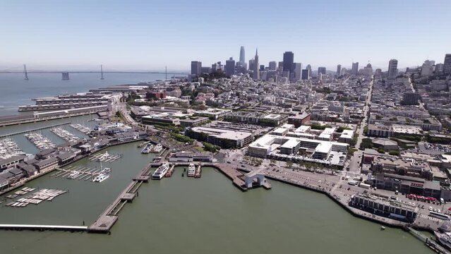 Aerial Shot of Fishermans Wharf and the San Fransisco Bay Bridge in Background 