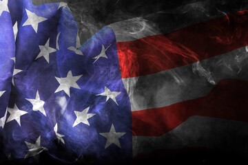 USA flag in flowing smoke. Abstract American flag on dark background
