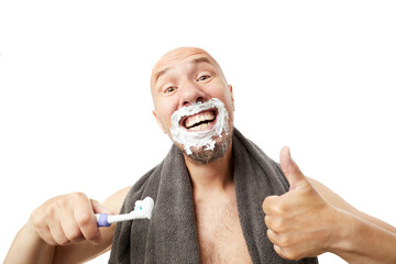 Сlose up view of a bald man brushing his teeth with toothpaste with emotions isolated on white background.