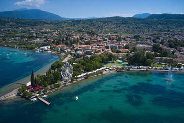 Fototapeta na wymiar Panorama, aerial view of the fountain in the town of Bardolino on Lake Garda. The famous Bardolino resort on Lake Garda, Italy.
