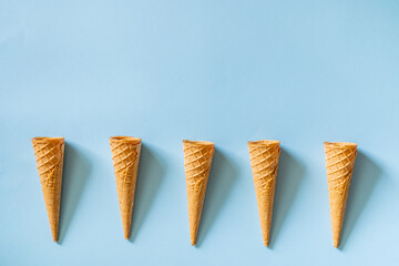 Ice cream cones on bright blue background