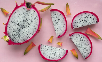 PITAHAYA OR DRAGON FRUIT, WHITE CUT OUT, ON PINK BACKGROUND