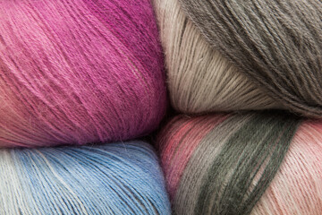 Twisted multi-colored threads for knitting in a variety of colors, close-up.