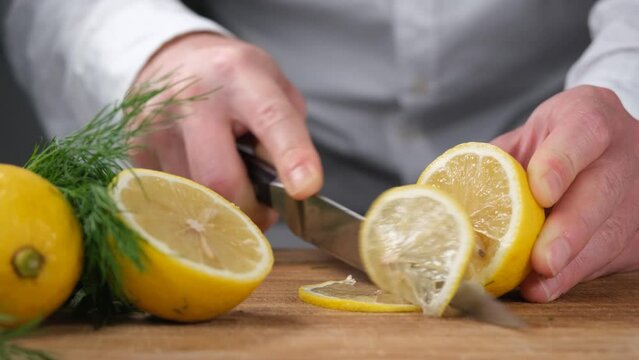 chef cutting lemon
