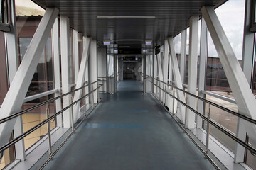 airport corridor after landing in front of the arrivals hall, an empty hall