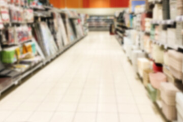 supermarket shelves in the department with boxes and baskets, shopping row background of household...
