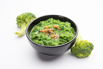 Fresh broccoli chutney or paste, puree in the bowl with raw pieces