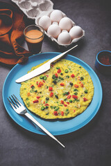 Indian Spiced Masala Omelet filled with fresh vegetable, healthy meal