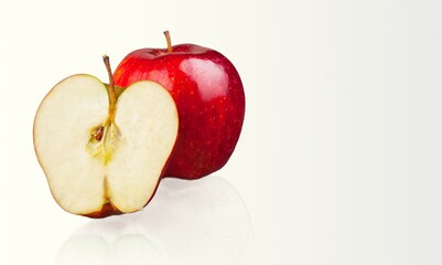 Red whole apple, half and a slice on background. Red apple set