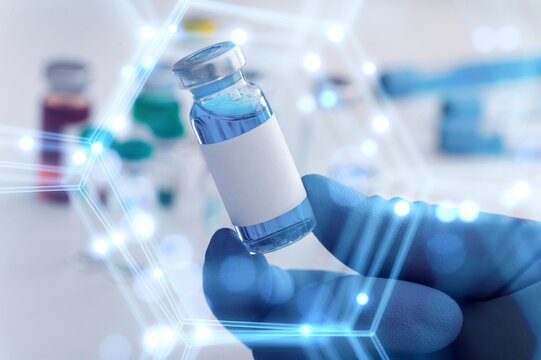 Scientist with tube and virtual screen with data scientific at genetic engineering lab. Biomedical engineer genetic working with tubes in biotechnical laboratory