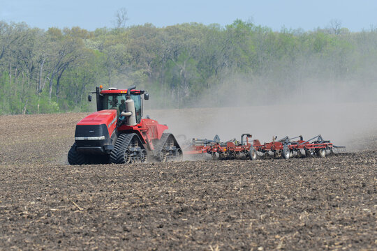 Oglesby, Illinois - USA - May 12, 2022; Case IH Steiger 580 Quadtrac pulling a Case yield-till system cultivator for spring planting