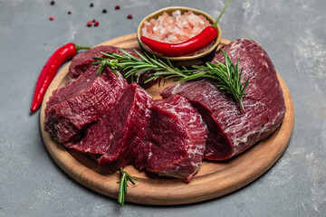Beef Tenderloin fillet with rosemary and spices. Preparing fresh beef steak ready to cook, Restaurant menu, dieting, cookbook recipe. place for text. top view