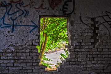 Broken wall in an abandoned and ruined house