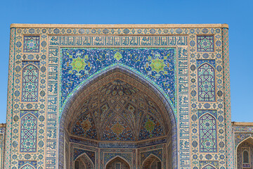 Tillya-Kari madrasah decorated with mosaics on Registan Square in Samarkand, Uzbekistan.