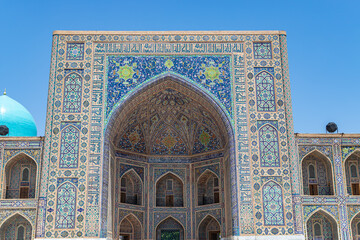 Tillya-Kari madrasah decorated with mosaics on Registan Square in Samarkand, Uzbekistan.