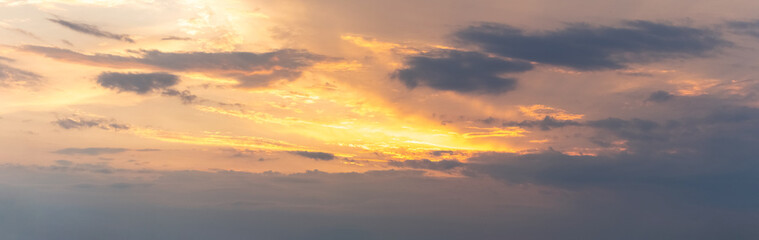 Dramatic sky with dark clouds during sunset