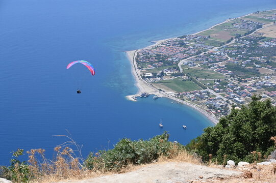 Paraglider flying on Oren beach in Milas, Mugla. Travel destination. Summer and holiday concept.