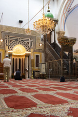 Muslim visitors praying in Abraham Mosque of Hebron. Tombs of Isaac and Rebecca are here