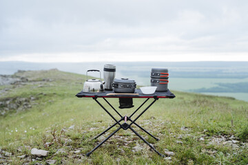 Equipment for camping kitchen, cooking in nature, a set of camping utensils, an iron kettle, a...