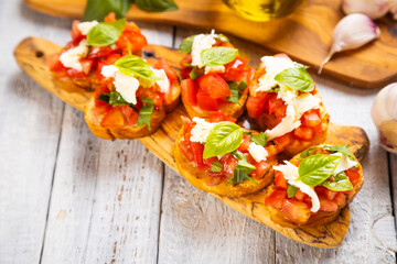 Italian bruschetta bread with tomato, basil and mozzarella cheese