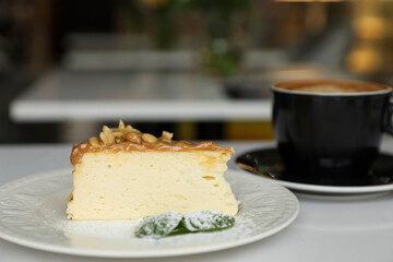 Tasty dessert and cup of fresh coffee on table in cafeteria