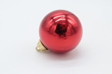 Christmas tree ornament in the shape of a red ball on a white background