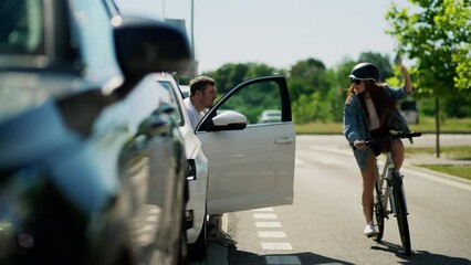 Bicycle accident in city. Woman cyclist riding a bike while car door opened