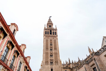 Fototapeta na wymiar La Giralda is the bell tower of Seville Cathedral in Seville, Spain