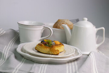Close up Sweet Dessert , Mixed Fruit Tart on a white plate