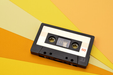 retro tape recorder cassette on a bright yellow background