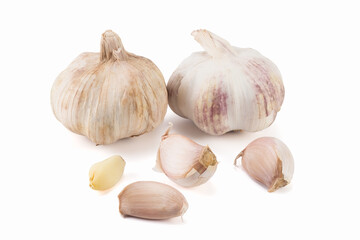 Garlic and cloves, isolated on bright backgrounds. Close up view.