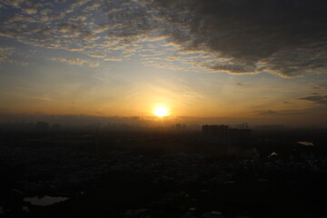 Fototapeta premium Sunrise scene from the rooftop at Ho Chi Minh City - Vietnam
