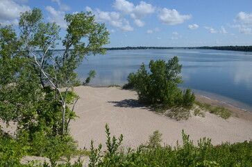 Dunes Beach sand dunes at Sandbanks Provincial Park in Ontario, Canada.   Sandbanks is the largest baymouth barrier dune formation in the world. It is located on Lake Ontario.