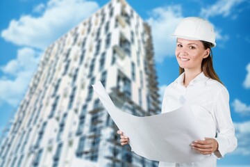 Young female engineer with a safety hardhat posing