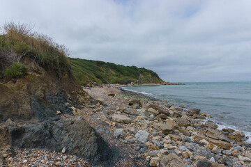 View of the north sea coast with stones on the beach to Cap Gris Nez, France