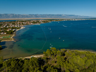 Croatia - The amazing Vir island with an old castle near the sea from drone view