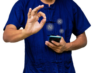 Asian farmer man looking to smartphone display screen Learn from the Internet