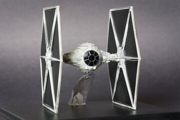 Obraz premium TIE Fighter miniature. The TIE LN starfighter simply known as the TIE Fighter is the standard imperial starfighter in the Star Wars universe.