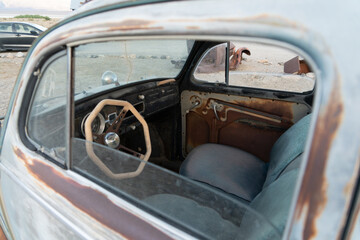 Fototapeta na wymiar Rustic And Vintage Automobiles In The Desolation Of Ballarat, California