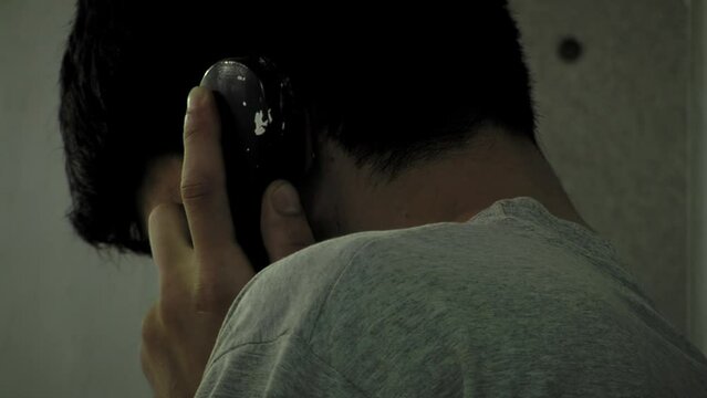 Prisoner Talking on the Phone at Olmos Prison, Buenos Aires Province, Argentina. Close Up.