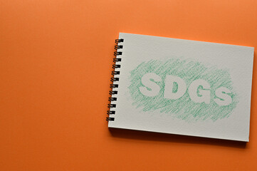 There is sketchbook with an illustration of SDGs.