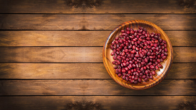 Raw red adzuki beans in the wooden bowl - Vigna angularis