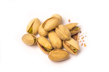Obraz premium some pistachios are lying on a white background