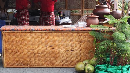
pottery on a woven bamboo table
