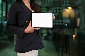 Businesswoman holding a blank screen of portable tablet touchpad. cropped