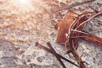 Crucifixion Of Jesus Christ. Cross With Nails And Crown Of Thorns on ground