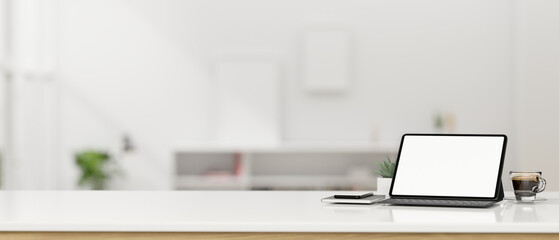 Obraz na płótnie Canvas Tablet mockup with wireless keyboard and empty space on tabletop over blurred office in background